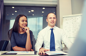 Image showing smiling business people meeting in office