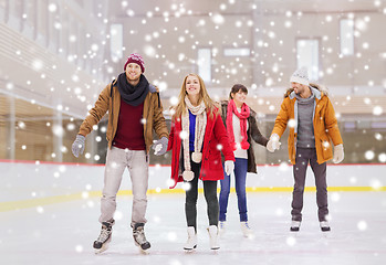 Image showing happy friends on skating rink