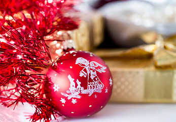 Image showing christmas decoration and golden box with ribbon