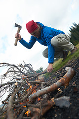 Image showing hiking man try to light fire