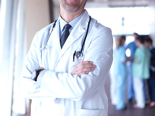 Image showing group of medical staff at hospital, doctor in front of team