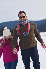 Image showing happy young couple having fun on fresh show on winter vacation