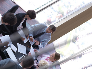 Image showing business people group on meeting at bright modern office