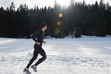 Image showing jogging on snow in forest