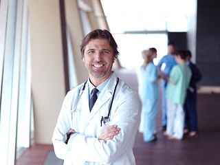 Image showing group of medical staff at hospital, doctor in front of team