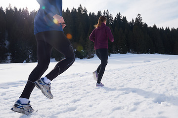 Image showing couple jogging outside on snow