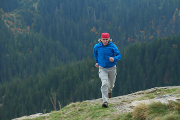 Image showing advanture man with backpack hiking