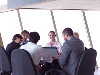 Image showing business people group on meeting at bright modern office