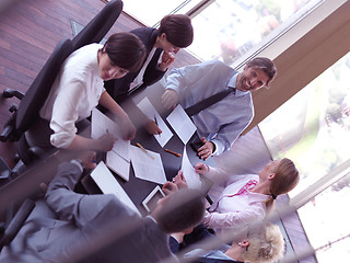 Image showing business people group on meeting at bright modern office