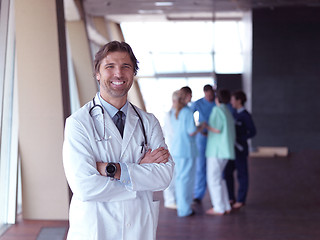 Image showing group of medical staff at hospital, doctor in front of team