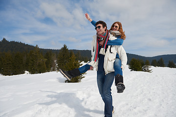 Image showing happy young couple having fun on fresh show on winter vacation