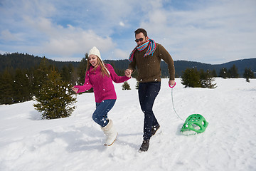 Image showing happy young couple having fun on fresh show on winter vacation