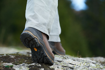 Image showing hiking man with trekking boots