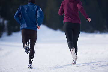 Image showing couple jogging outside on snow