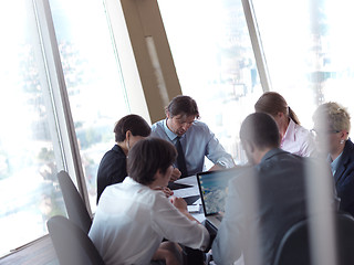 Image showing business people group on meeting at bright modern office