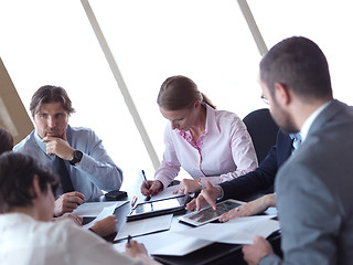 Image showing business people group on meeting at bright modern office