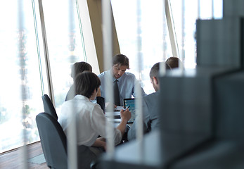 Image showing business people group on meeting at bright modern office