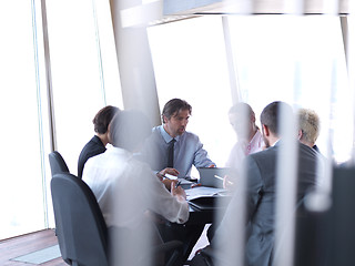 Image showing business people group on meeting at bright modern office