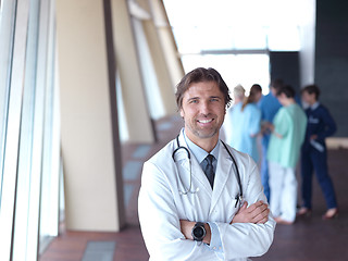 Image showing group of medical staff at hospital, doctor in front of team