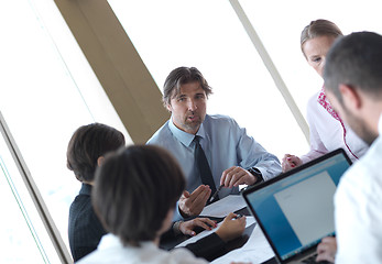 Image showing business people group on meeting at bright modern office