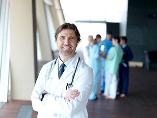 Image showing group of medical staff at hospital, doctor in front of team