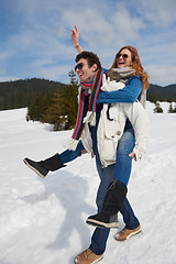 Image showing happy young couple having fun on fresh show on winter vacation