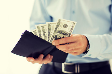 Image showing close up of businessman hands holding money