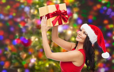 Image showing beautiful sexy woman in santa hat with gift box