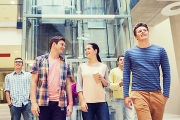 Image showing group of smiling students with paper coffee cups