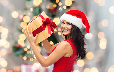 Image showing beautiful sexy woman in santa hat with gift box