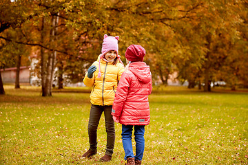 Image showing two happy little girls in autumn park