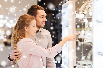 Image showing couple looking to shopping window at jewelry store