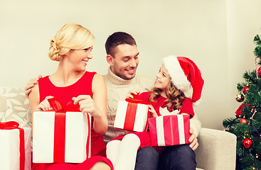 Image showing happy family opening gift boxes