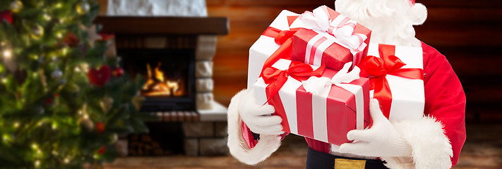 Image showing man in costume of santa claus with gift boxes