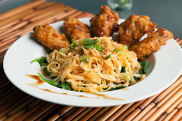 Image showing Chicken Wings with Noodles and Spinach