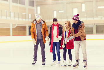 Image showing happy friends on skating rink