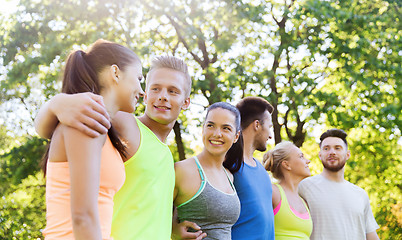 Image showing group of happy friends or sportsmen outdoors