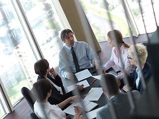 Image showing business people group on meeting at bright modern office