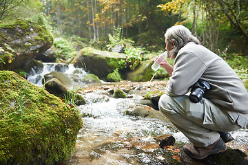 Image showing man drinking fresh water from spring