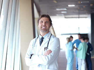 Image showing group of medical staff at hospital, doctor in front of team