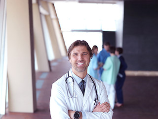 Image showing group of medical staff at hospital, doctor in front of team