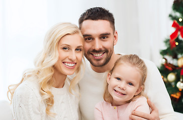 Image showing happy family at home with christmas tree