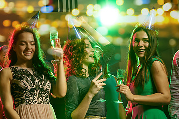 Image showing happy friends with glasses of champagne in club