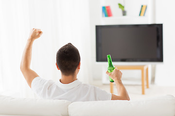 Image showing man watching tv and drinking beer at home