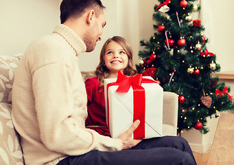 Image showing smiling father and daughter looking at each other