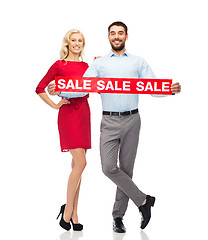 Image showing happy couple with red sale sign