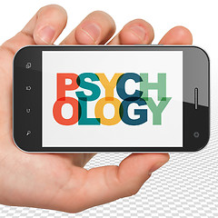 Image showing Healthcare concept: Hand Holding Smartphone with Psychology on  display