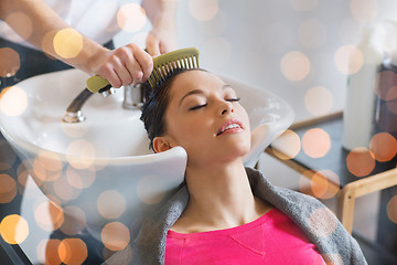 Image showing happy young woman at hair salon