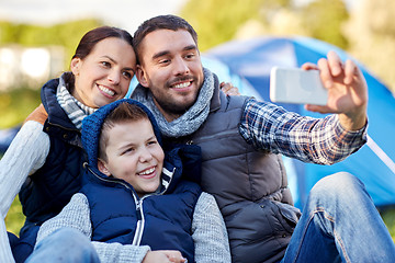 Image showing family with smartphone taking selfie at campsite