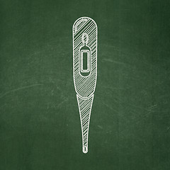 Image showing Medicine concept: Thermometer on chalkboard background